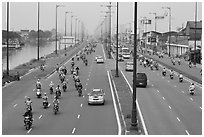Busy expressway on banks of Saigon Arroyau. Cholon, Ho Chi Minh City, Vietnam ( black and white)
