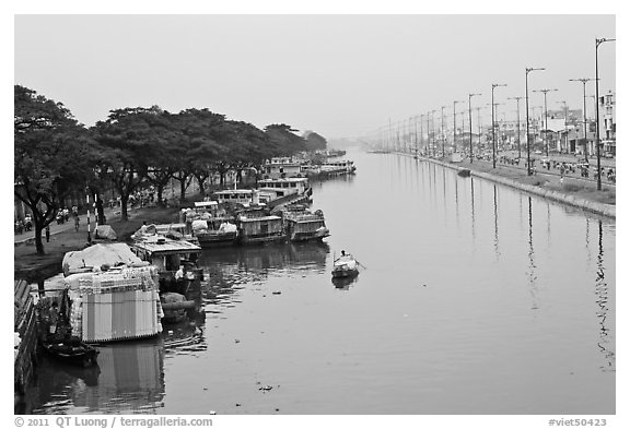 Cargo boats moored on Saigon Arroyau. Cholon, Ho Chi Minh City, Vietnam (black and white)