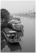 Mariners aboard barges, Saigon Arroyau. Cholon, Ho Chi Minh City, Vietnam ( black and white)