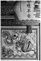Lantern and ceramic dragon, Ha Chuong Hoi Quan Pagoda. Cholon, District 5, Ho Chi Minh City, Vietnam (black and white)