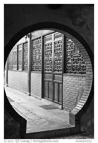 Circular door, Ha Chuong Hoi Quan Pagoda. Cholon, District 5, Ho Chi Minh City, Vietnam (black and white)