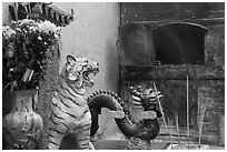Ceramic tiger, dragon, and oven, Quan Am Pagoda. Cholon, District 5, Ho Chi Minh City, Vietnam ( black and white)