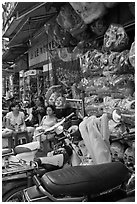 Store selling traditional dragon masks. Cholon, Ho Chi Minh City, Vietnam ( black and white)