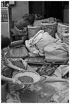 Woman preparing traditional medicine ingredients. Cholon, Ho Chi Minh City, Vietnam ( black and white)