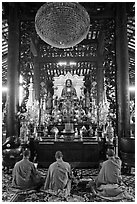 Monks in worship, Giac Lam Pagoda, Tan Binh District. Ho Chi Minh City, Vietnam ( black and white)