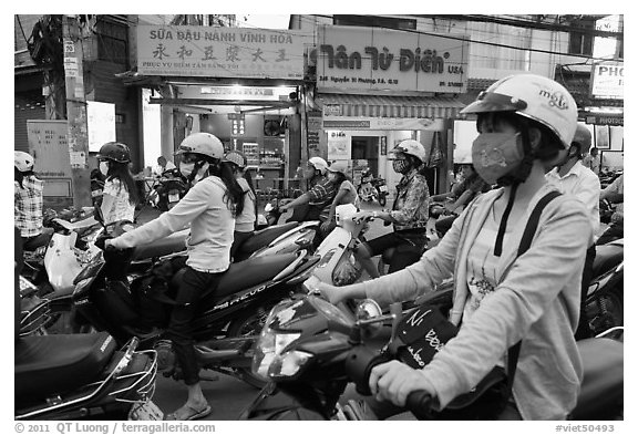 Commuters on motorcyles in stopped traffic. Ho Chi Minh City, Vietnam