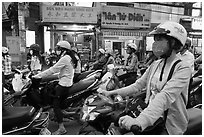 Commuters on motorcyles in stopped traffic. Ho Chi Minh City, Vietnam ( black and white)