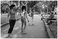 Young women practising dance, Cong Vien Van Hoa Park. Ho Chi Minh City, Vietnam ( black and white)