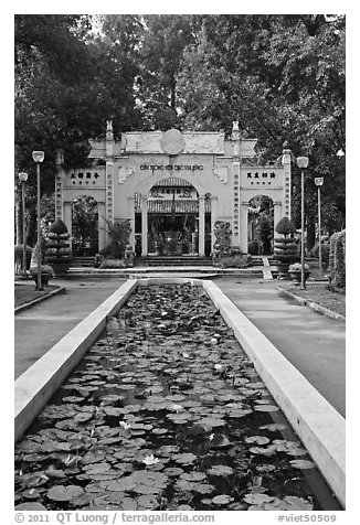 Lilly pond and temple gate, Van Hoa Park. Ho Chi Minh City, Vietnam (black and white)