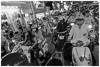 Street filled with motorcycles at rush hour. Ho Chi Minh City, Vietnam ( black and white)