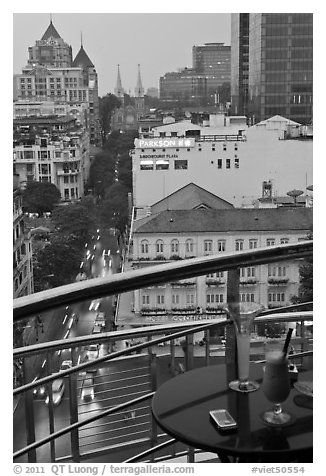 Drinks and view from rooftop bar of Hotel Caravelle. Ho Chi Minh City, Vietnam (black and white)