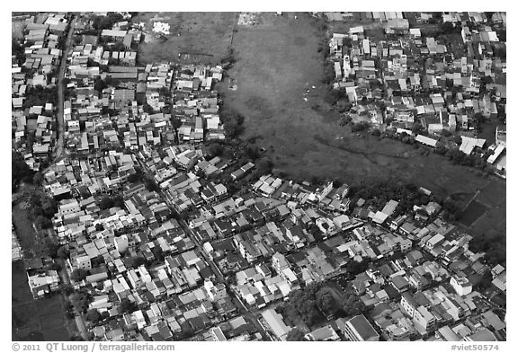 Aerial view of houses and fields on the outskirts of the city. Ho Chi Minh City, Vietnam (black and white)