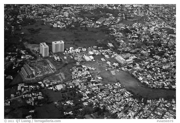 Aerial view of houses and high-rises on the outskirts of the city. Ho Chi Minh City, Vietnam