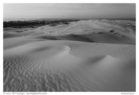 Mui Ne sand dunes, town in the distance. Mui Ne, Vietnam (black and white)