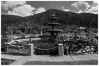 Fountain and forested peak. Ta Cu Mountain, Vietnam ( black and white)