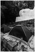 Child and tents set up below head of Buddha statue. Ta Cu Mountain, Vietnam ( black and white)