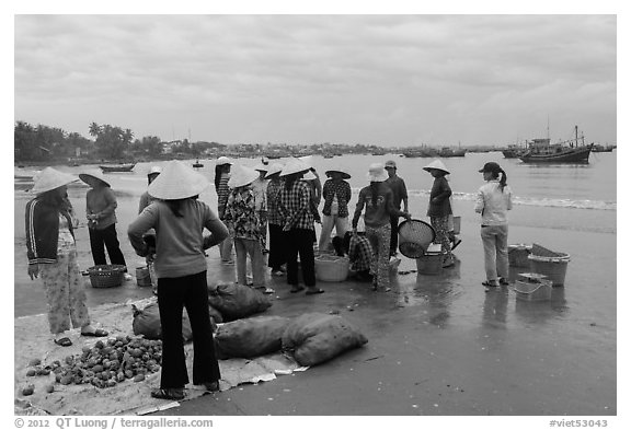 Shore activity in front of Lang Chai fishing village. Mui Ne, Vietnam (black and white)