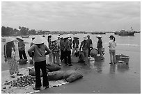 Shore activity in front of Lang Chai fishing village. Mui Ne, Vietnam ( black and white)