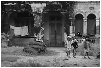 Children in front of home. Mui Ne, Vietnam (black and white)