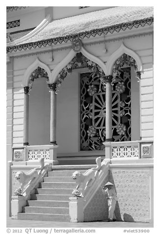 Cao Dai follower and temple detail. Tay Ninh, Vietnam (black and white)