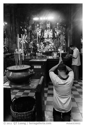 Worshippers inside Jade Emperor Pagoda. Ho Chi Minh City, Vietnam