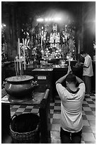 Worshippers inside Jade Emperor Pagoda. Ho Chi Minh City, Vietnam ( black and white)