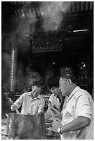 Worshippers burning incense, Thien Hau Pagoda. Cholon, District 5, Ho Chi Minh City, Vietnam (black and white)