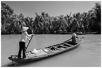 Women row canoes, Phoenix Island. My Tho, Vietnam ( black and white)