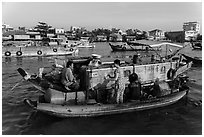 Seller and buyer talking across boats, Cai Rang floating market. Can Tho, Vietnam ( black and white)