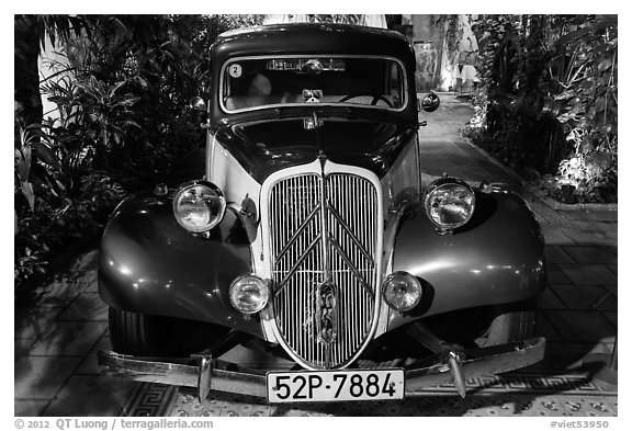 Old Citroen car in garden. Ho Chi Minh City, Vietnam (black and white)