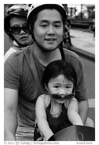 Family on motorbike with sunglasses. Ho Chi Minh City, Vietnam