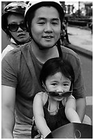 Family on motorbike with sunglasses. Ho Chi Minh City, Vietnam ( black and white)
