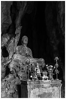 Altar and Buddha statue in grotto. Da Nang, Vietnam ( black and white)