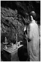 Buddha statue in narrow cave, Marble Mountains. Da Nang, Vietnam ( black and white)