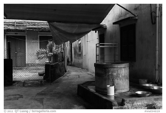 Well and alley. Hoi An, Vietnam (black and white)