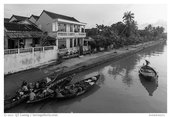 Waterfront with people selling from boats. Hoi An, Vietnam (black and white)