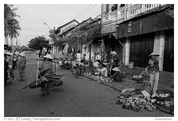 Fruit and vegetable vendors in old town. Hoi An, Vietnam (black and white)