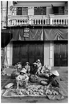 Banana vendors and historic house. Hoi An, Vietnam ( black and white)