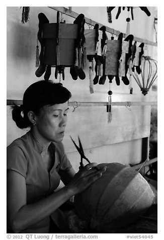 Woman working on paper lantern. Hoi An, Vietnam (black and white)