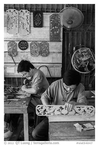Wood carving workshop. Hoi An, Vietnam (black and white)