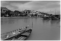Boats, Thu Bon River, and houses. Hoi An, Vietnam (black and white)