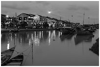 Waterfront, boats, and Thu Bon River at dusk. Hoi An, Vietnam ( black and white)