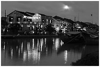 Moonrise over houses and river. Hoi An, Vietnam ( black and white)