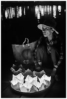 Woman selling floating candles at night. Hoi An, Vietnam ( black and white)