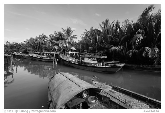 River channel and boats near Cam Kim Village. Hoi An, Vietnam (black and white)