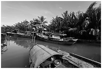 River channel and boats near Cam Kim Village. Hoi An, Vietnam ( black and white)