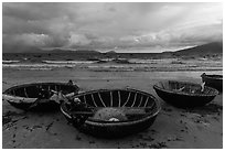Coracle boats on beach during storm. Da Nang, Vietnam ( black and white)