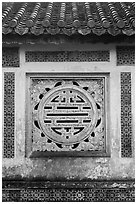 Window in the motif of Chinese symbol meaning Longevity, citadel. Hue, Vietnam ( black and white)