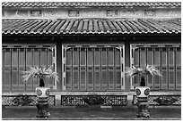 Facade with red and golden doors, imperial citadel. Hue, Vietnam (black and white)