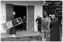 Monks carrying furniture, Thien Mu pagoda. Hue, Vietnam ( black and white)